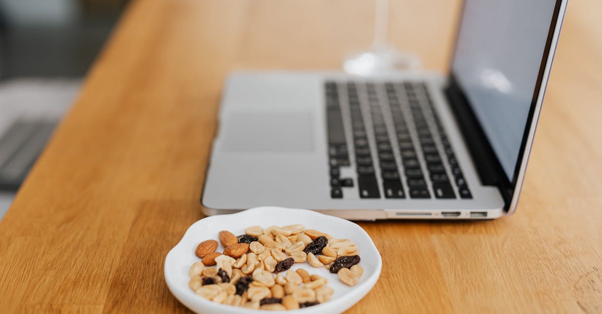 How are wasabi nuts made? - Nuts in a Bowl next to a Laptop