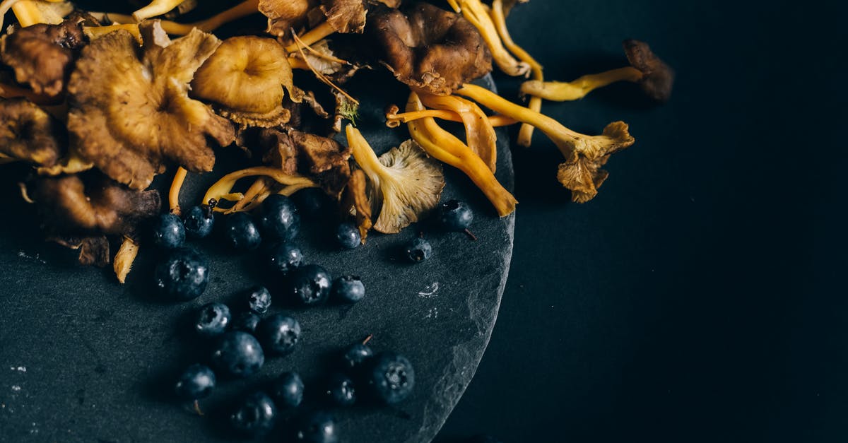 How can bitterness from dried mushrooms be avoided? - Blueberries and Mushrooms on Black Round Surface