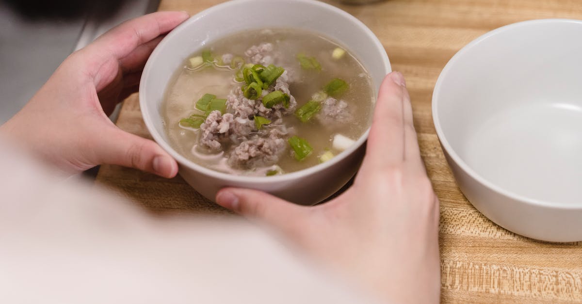 How can I achieve flavorful, gelatinous pork broth economically? - Soup Dish in Ceramic Bowl