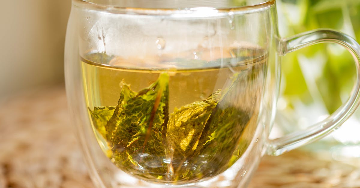 How can I add flavor to green tea at home? - Cup of herbal tea on table