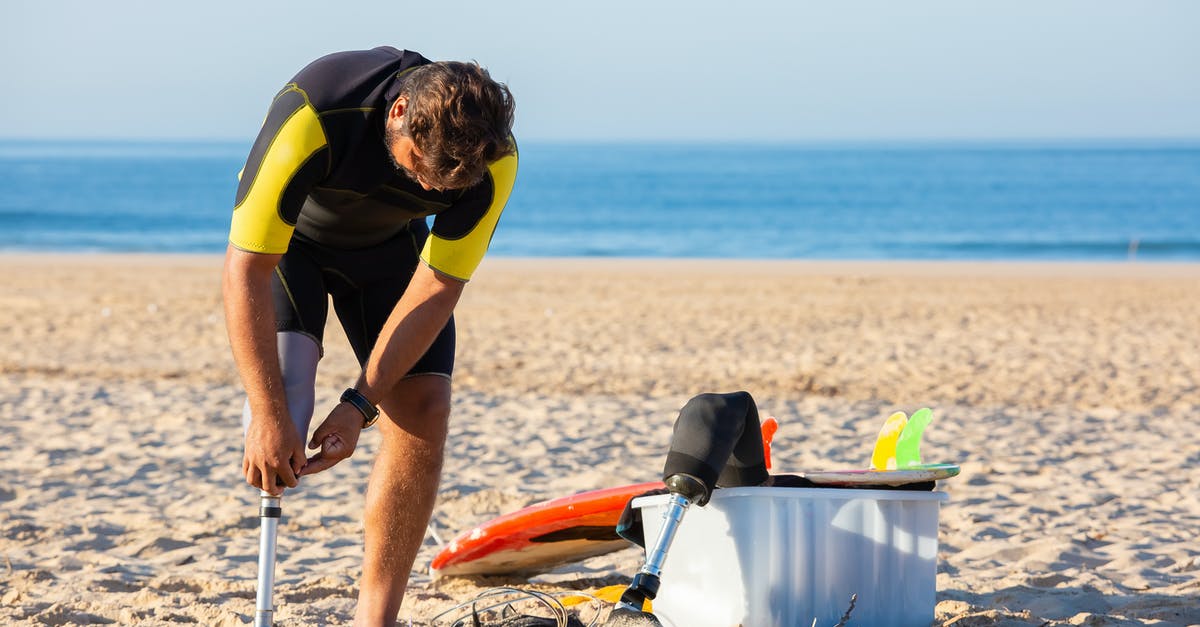 How can I adjust oven temperature correctly - Man in wetsuit corrects prosthetic leg