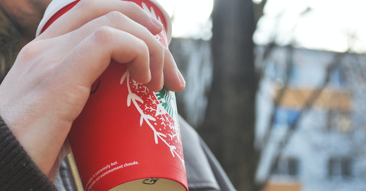 How can I approximate a Starbucks latte at home? - Person Holding Red Cup