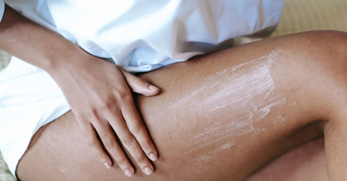 How can I BBQ everyday without the cleaning? - Woman massaging leg with lotion in bedroom