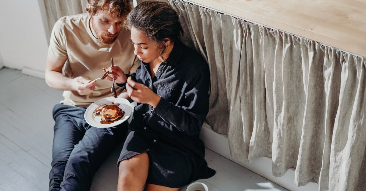 How can I cool chocolate in a couple of minutes? - Man and Woman Eating Under Kitchen Table