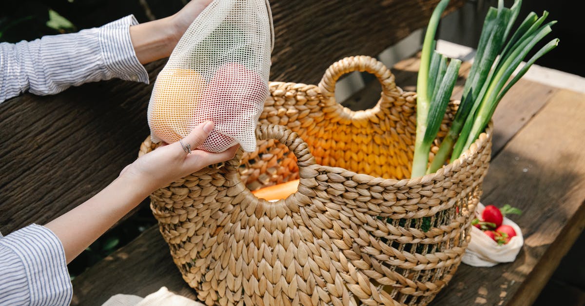 How can I fix a bitter raw leek soup? - Crop anonymous female placing fresh ripe capsicums in reusable bag into wicker basket with vegetables on wooden bench in sunny garden