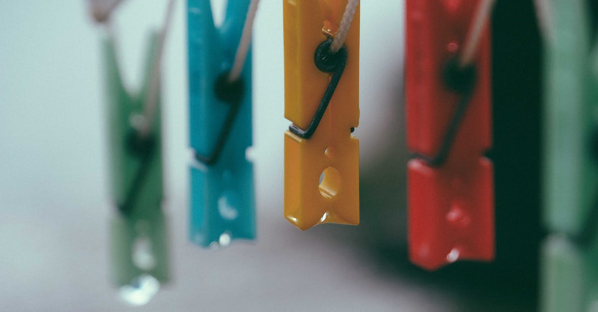 How can I fix my dry crumbly cookie dough? - Row of plastic multicolored clothes pegs hanging on holder rope against blurred background