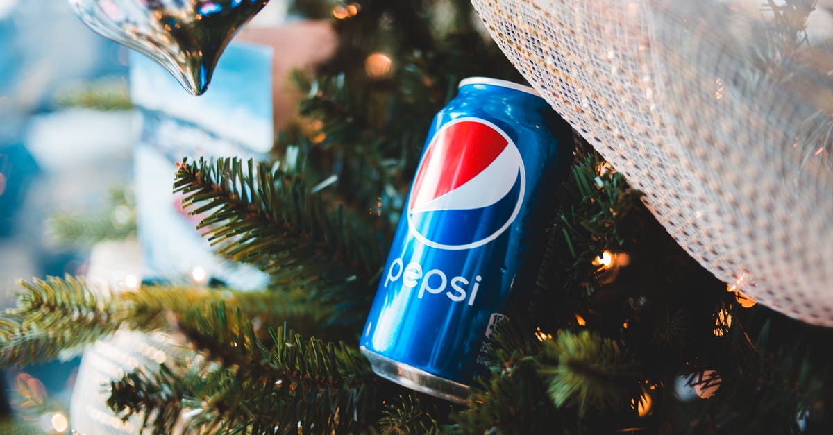 How can I flavor my ganache? - Shiny can of soft drink on Christmas tree branch