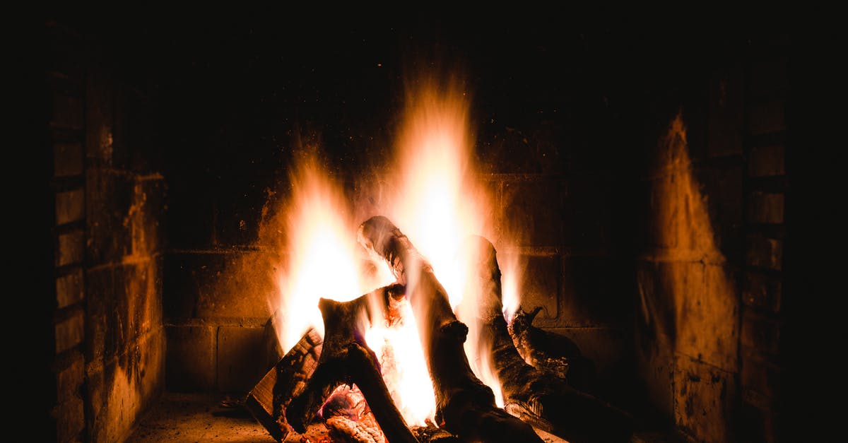 How can I light charcoal faster? - Photo of Lighted Firewoods in Dark Place