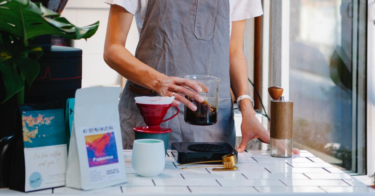 How can I make 'rich chocolate' flavor? - Woman in apron preparing coffee in cafe