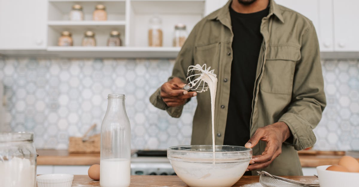 How can I make milk cocoa powder so it does not stick to the top and bottom? - A Man Checking the Texture of the Batter