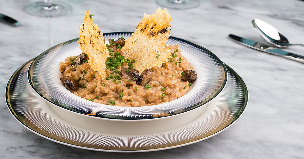 How can I make my risotto less firm? - Brown and Yellow Dish on White Ceramic Round Plate