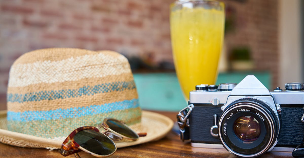 How can I make my the colour of non-dairy flan more like a classic flan? - Gray and Black Dslr Camera Beside Sun Hat and Sunglasses