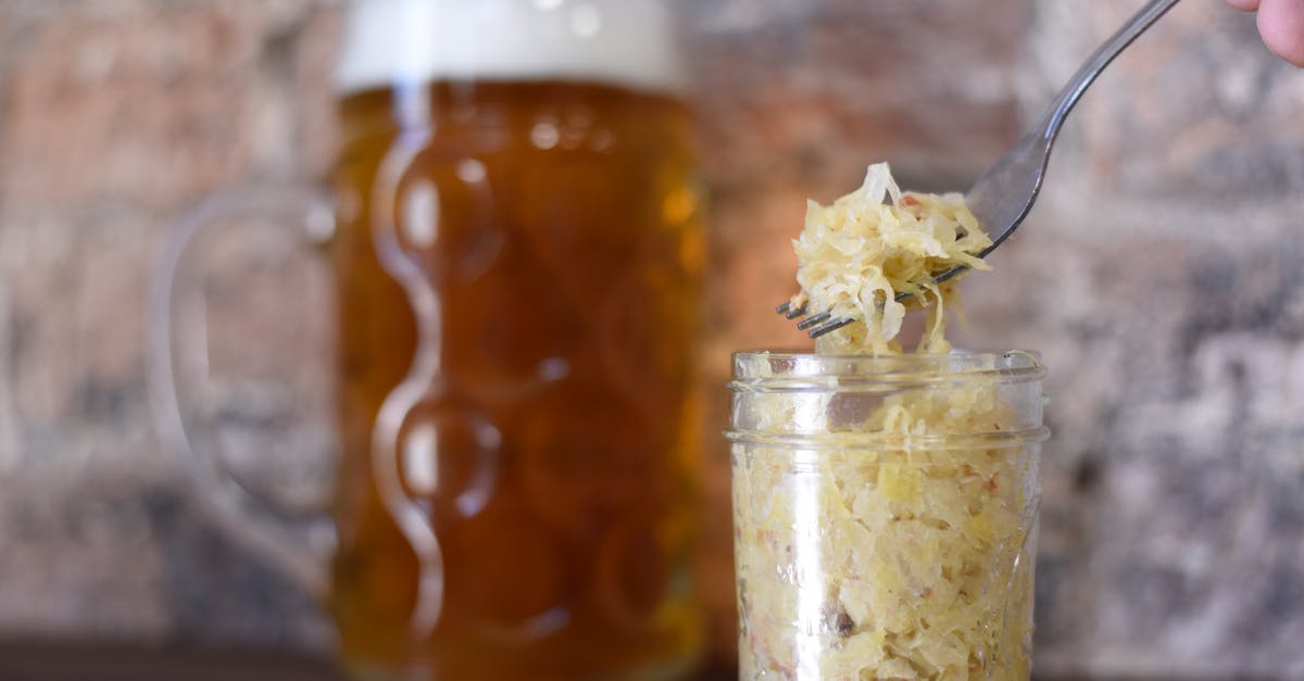 How can I make sauerkraut to best preserve the probiotic elements? - Person Using Fork