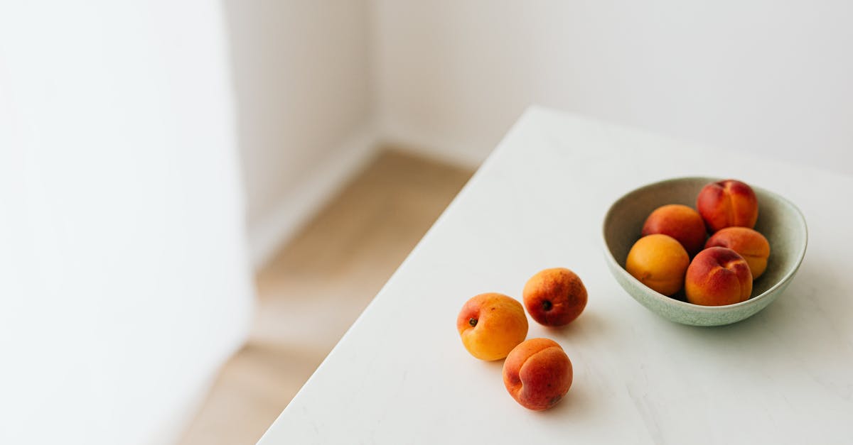 How can I minimize stirring when blending whole fruits? - Fresh apricots placed on white table