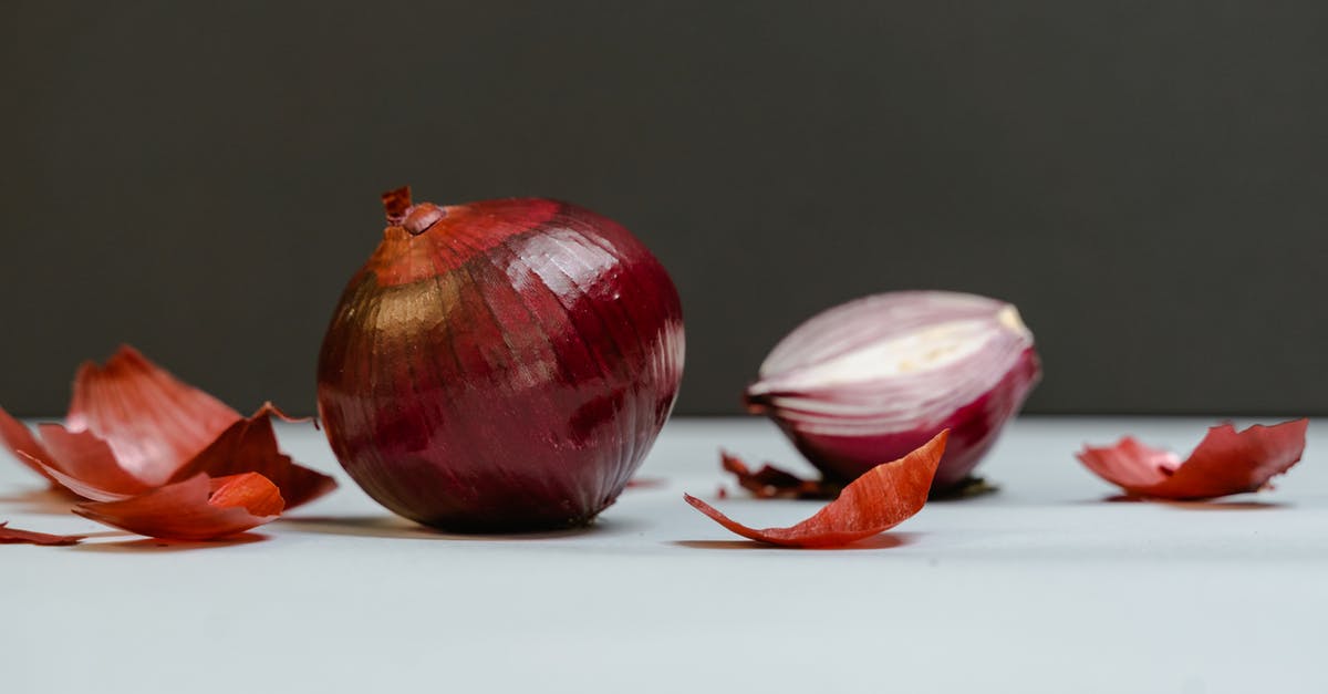 How can I peel pearl onions quickly? - Close-Up Shot of Onions on a White Surface