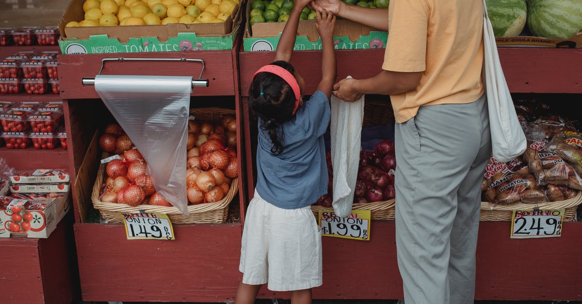 How can I save flour from little insects? [duplicate] - Ethnic woman choosing fruits with daughter in market