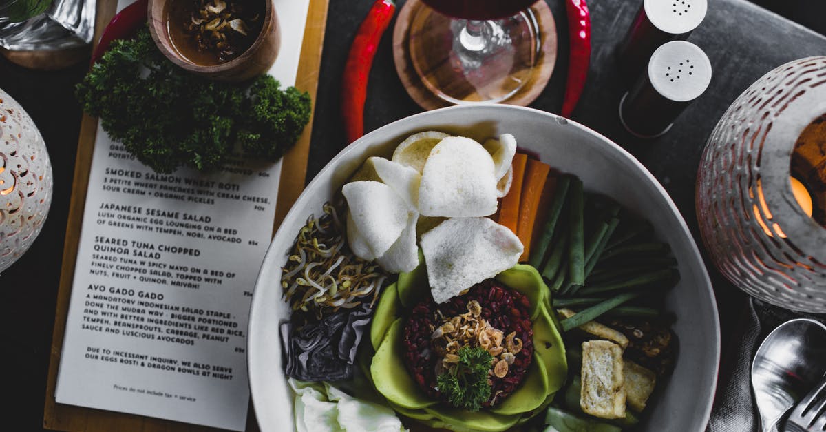 How can I susbtitute unseasoned rice vinegar for seasoned? - Salad bowl with steamed veggies and red rice on table in restaurant