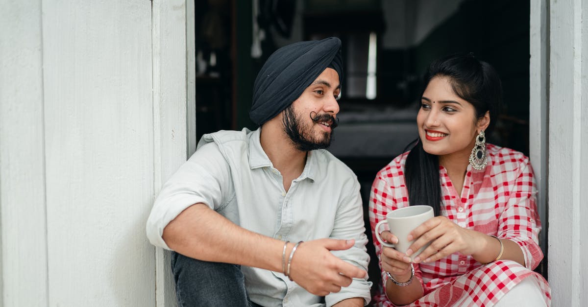 How can I tell if the tea has been stored properly, is not too stale or oxidized? - Positive Indian spouses in casual outfits sharing interesting stories while drinking morning coffee on doorstep of house How can I tell if the tea has been stored properly, is not too stale or oxidized? - Positive Indian spouses in casual outfits sharing interesting stories while drinking morning coffee on doorstep of house