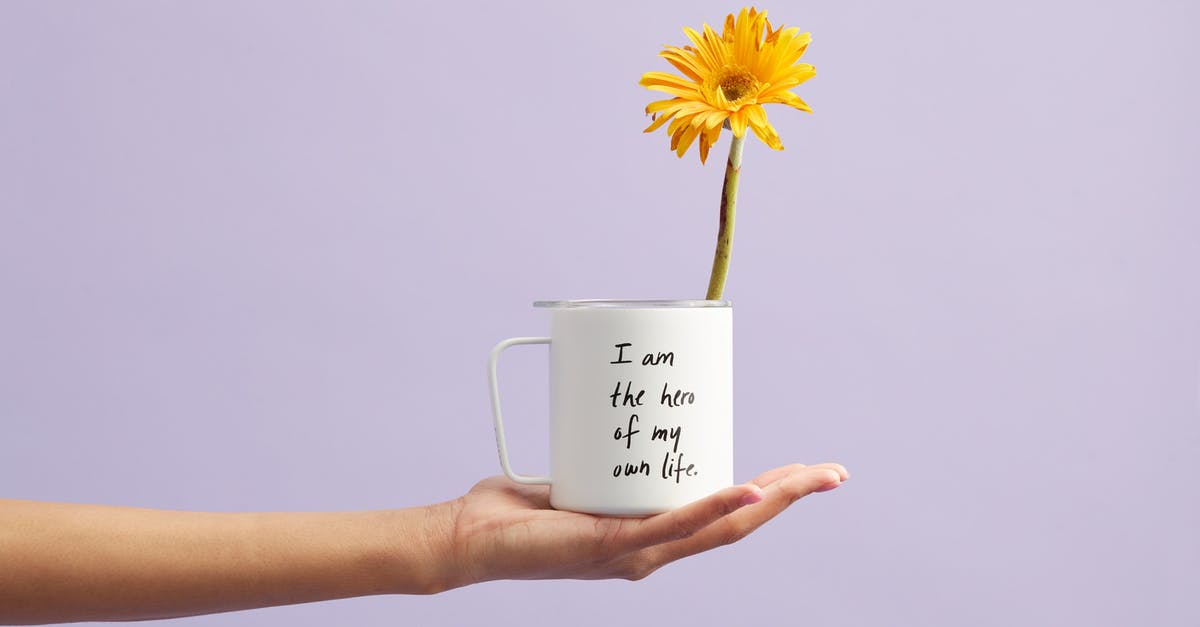 How can I tell if vitelottes/purple potatoes have "green flesh"? - Yellow Petaled Flower In White Mug