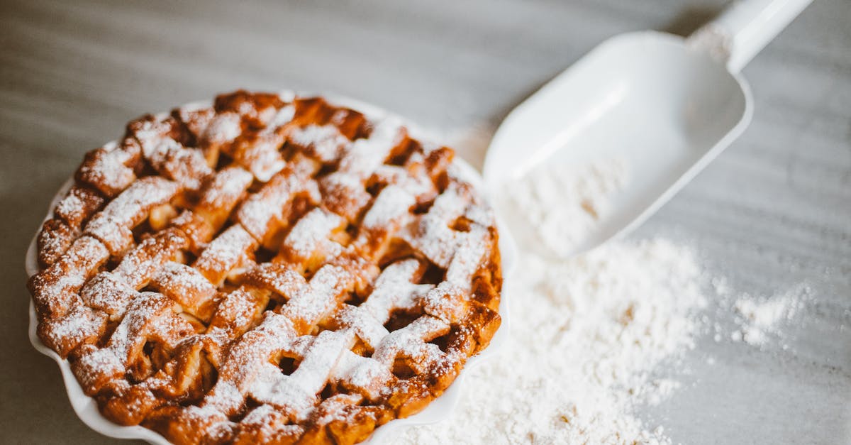 How can I thicken an already cooked pie filling? - A Pie and Scooper and Spilled Flour on a Flat Surface