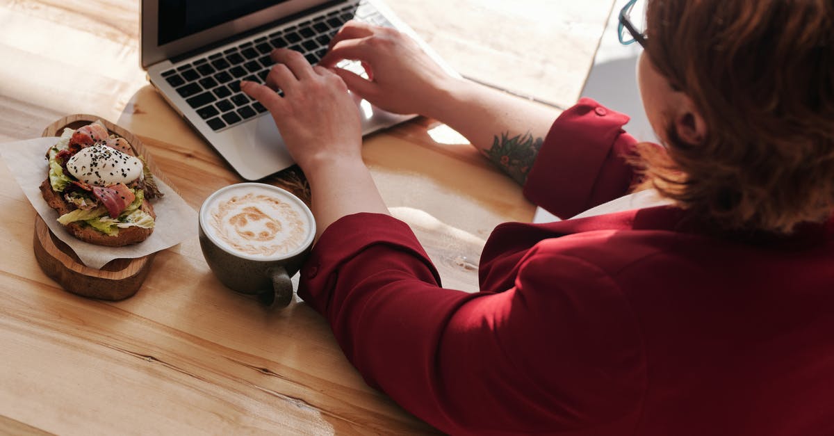 How can I use persimmons in a cooked dish? - Woman Using MacBook Pro