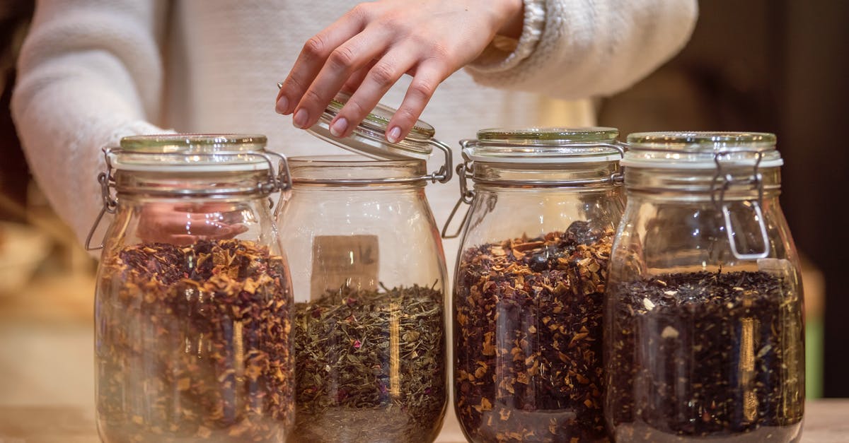 How can I warm bread making ingredients to room temperature?  - Female standing at table with glass jars of tea