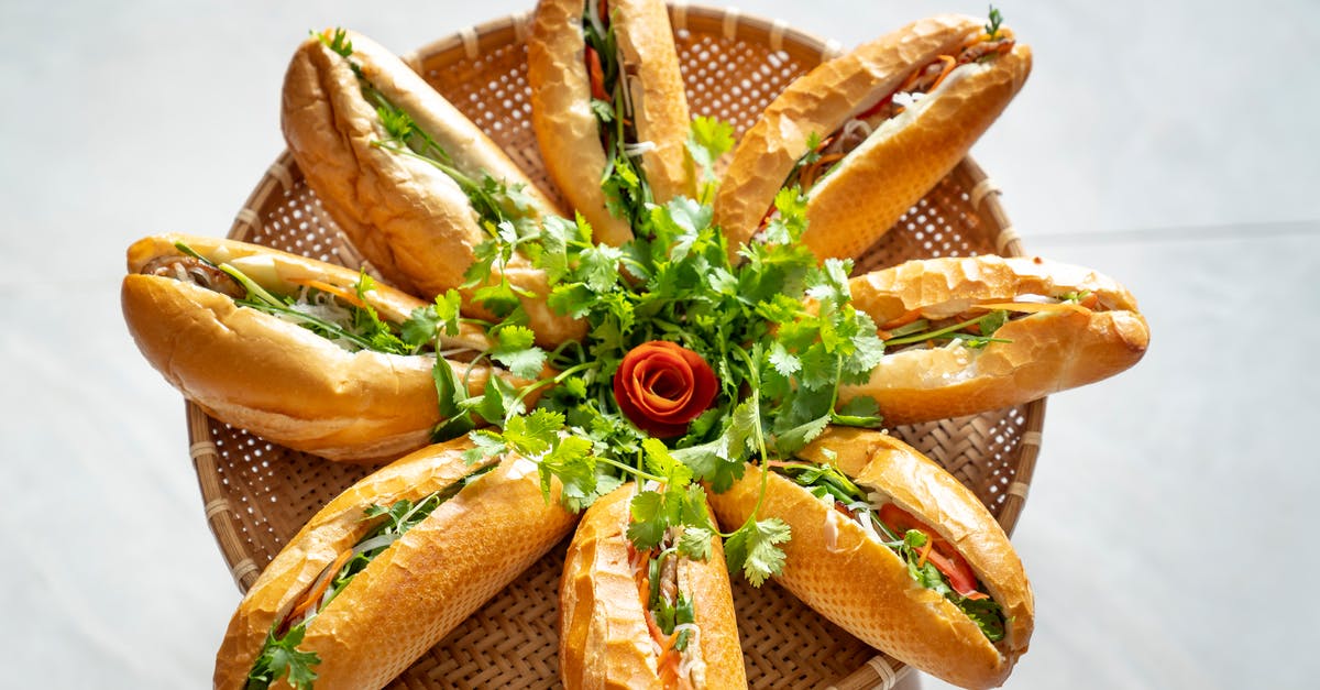 How can I warm bread making ingredients to room temperature?  - Sandwiches decorated with green arugula leaves