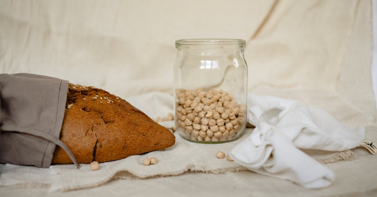 How can I warm bread making ingredients to room temperature?  - Brown and White Beans in Clear Glass Jar