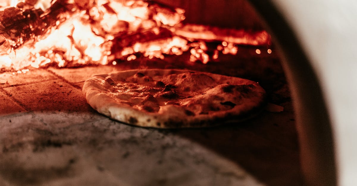 How can you cook milk without it burning the pan? - Selective Focus Photo of Pizza in Furnace