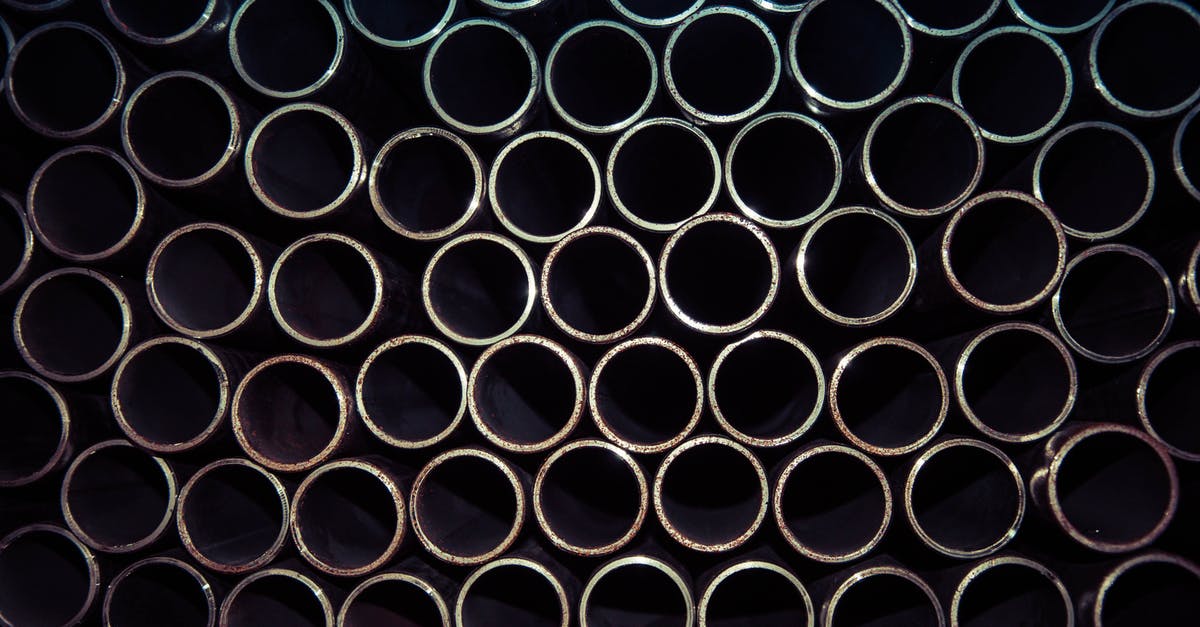 How can you make gray or black butter? - Close Up Photo of Gray Metal Pipes