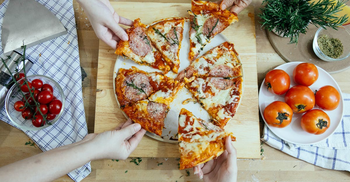 How deep do you need to insert the probe in a piece of meat to guarantee accuracy? - Crop friends taking slices of delicious pizza from cutting board