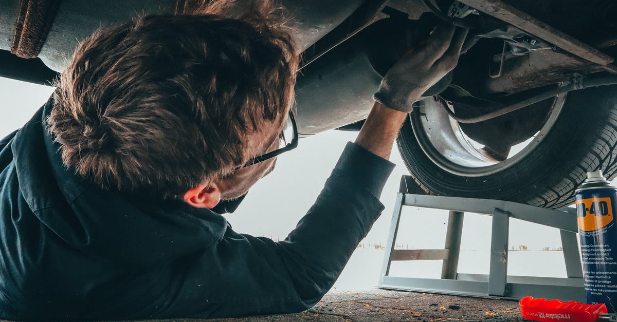 How did grease get in under cooktop on stove? - Man Fixing Vehicle Engine