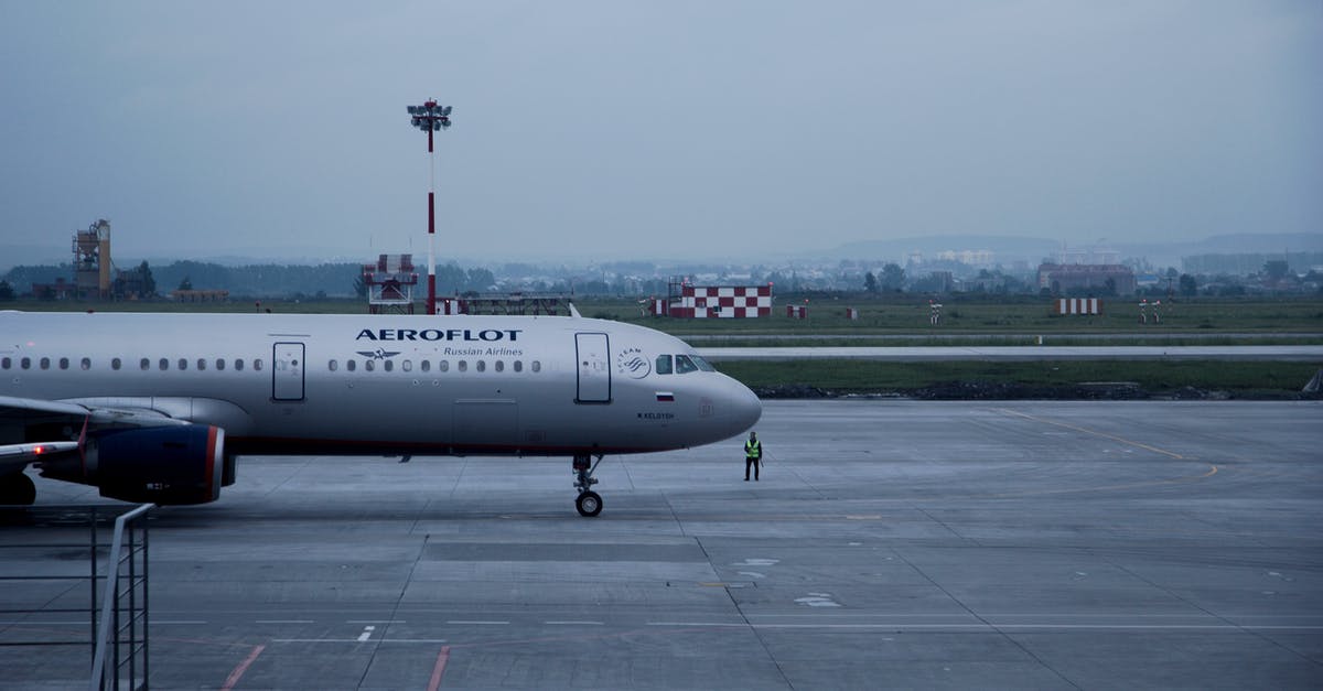 How do commercial operations defrost large amounts - White Aeroflot Passenger Plane on Airport