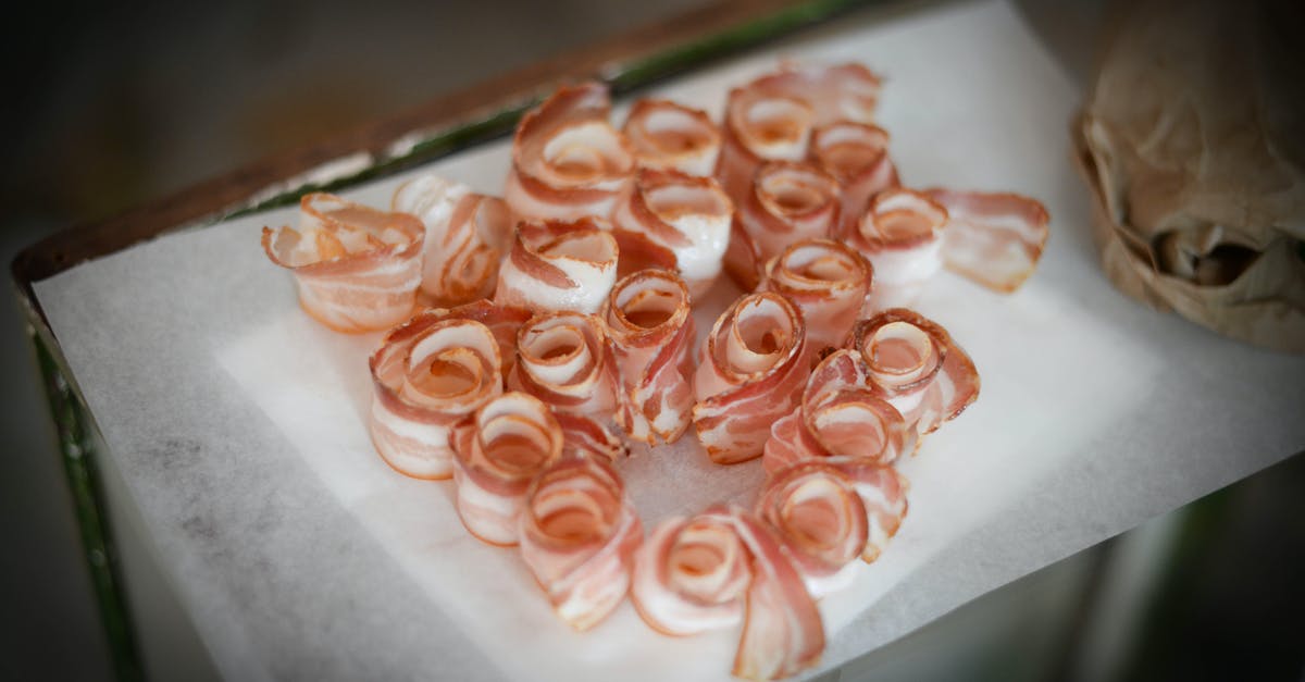 How do cooks prepare belly pork in a restaurant? - Delicious bacon slices on napkin on table