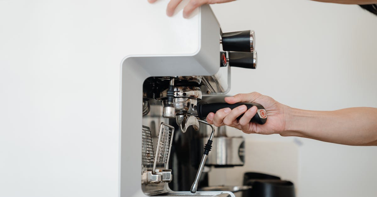 How do espresso machines hold pressure at all? - Person Using Espresso Machine