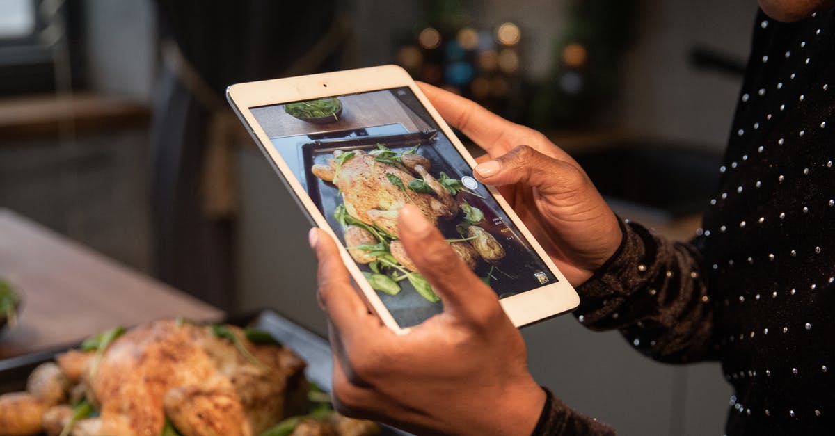 How do I accurately take a chicken thigh's temperature? - Person Taking a Picture of Food