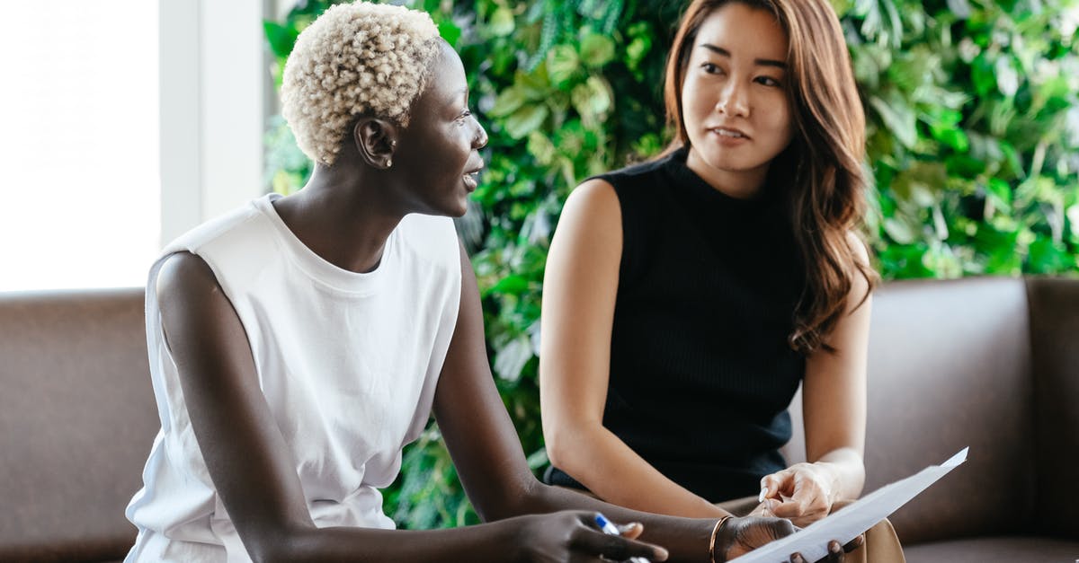 How do I check stew doneness? - Diverse women talking about job while discussing contract and looking at each other in conference hall