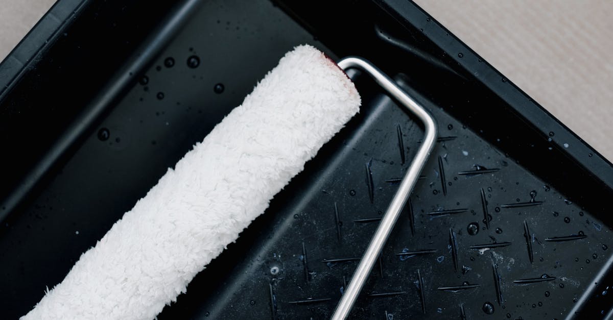 How do I clean my hob? - From above of clean roller for repair on plastic tank for paint at home