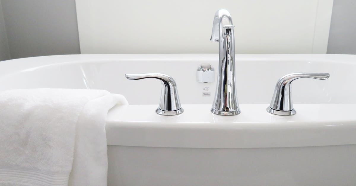 How do I clean the bottom of a porcelain pan? - Towel Hanged on Bathtub