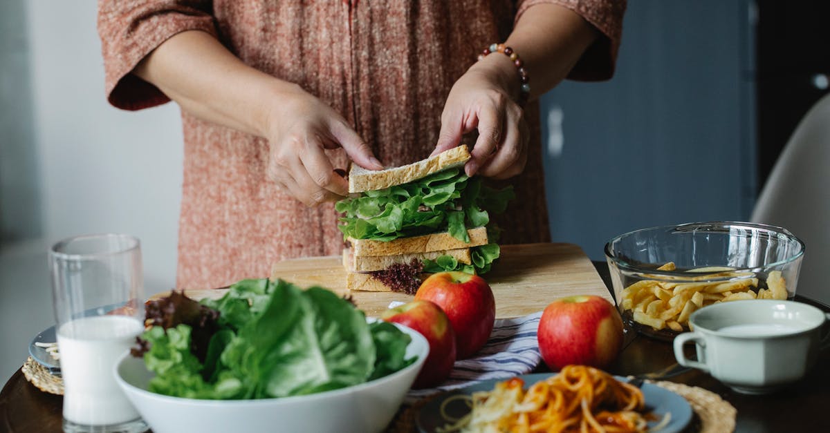 How do I cook toast on an Aga? - Crop woman making sandwich with salad