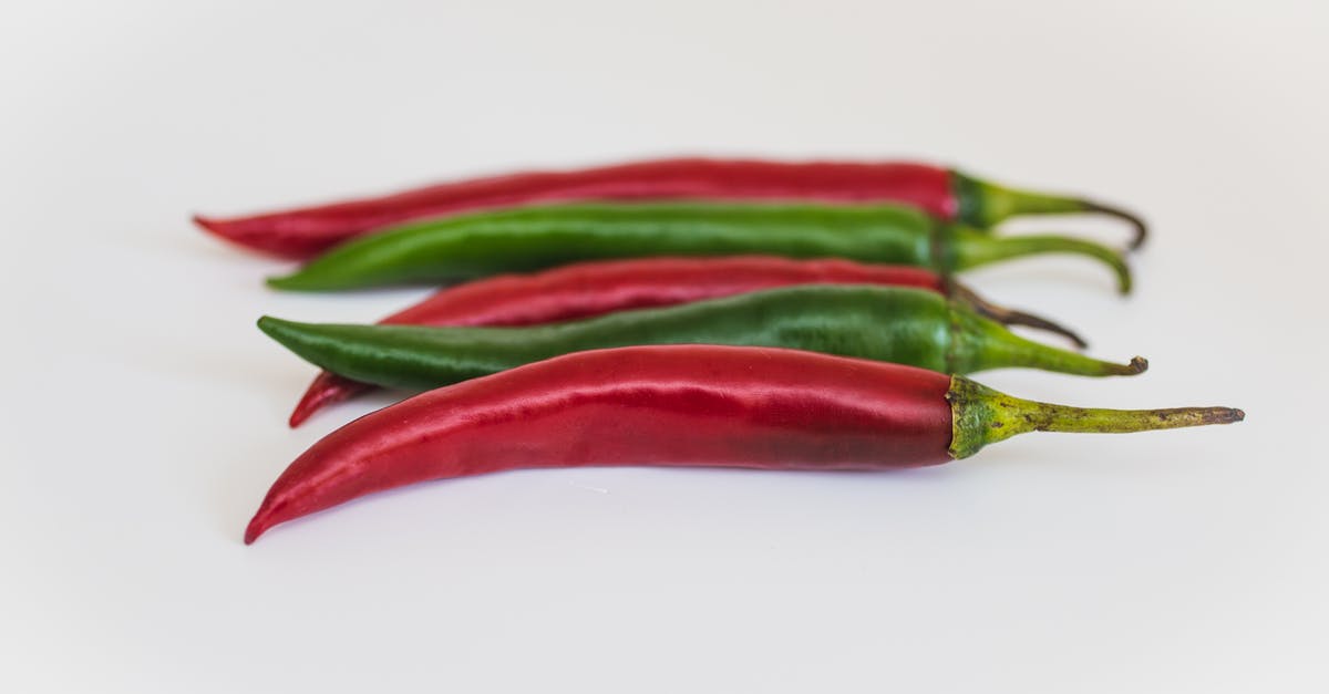 How do I dehydrate hot peppers in the oven? - Two Green and Three Red Chili Peppers