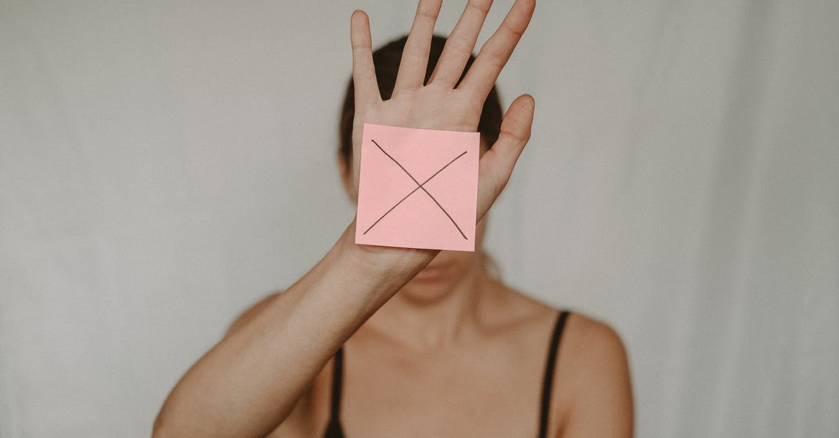 How do I identify a bad sharpener? - Unrecognizable young woman demonstrating prohibition sign showing gesture of refuse using hand and note with sign stop