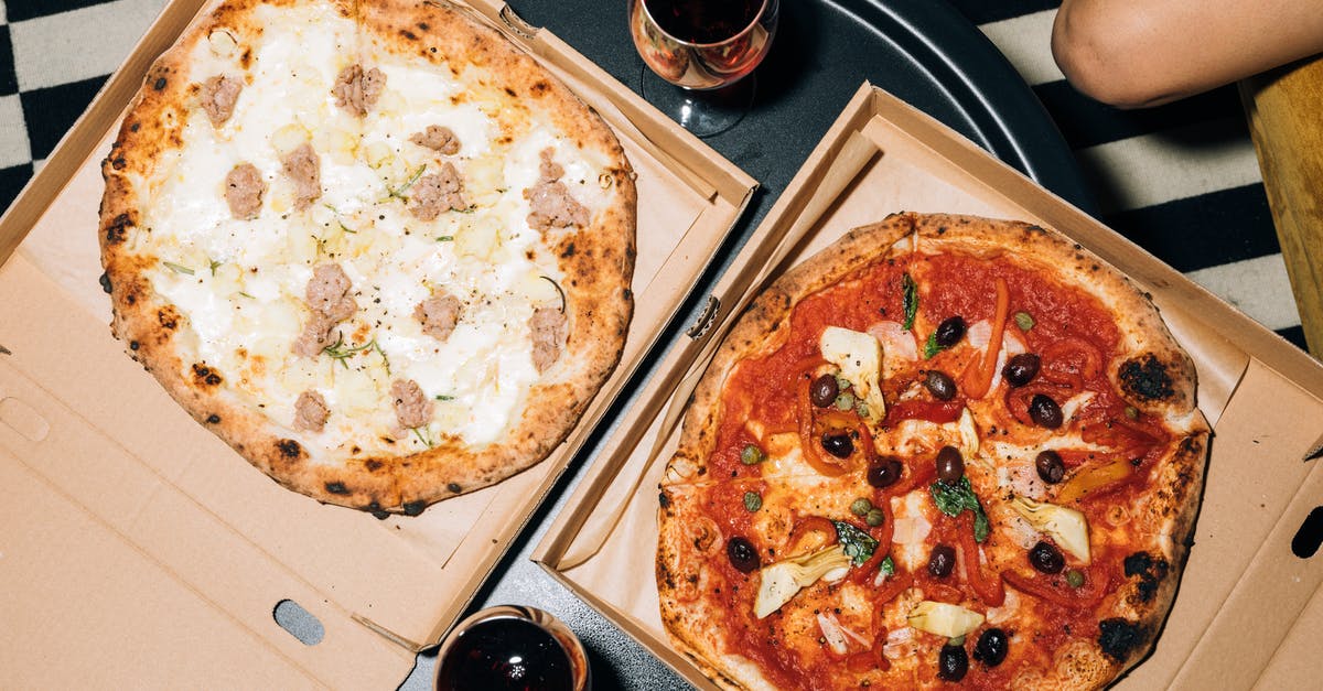 How do I keep leftover tomato sauce from spoiling? - Top View of Two Pizzas on a Table