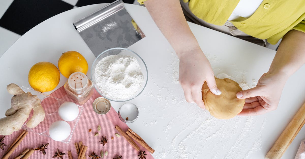 How do I make a "baking powder" substitute in a pinch? - From above of crop anonymous female preparing tasty pastry sitting at white table near bowl of flour and eggs and other ingredients