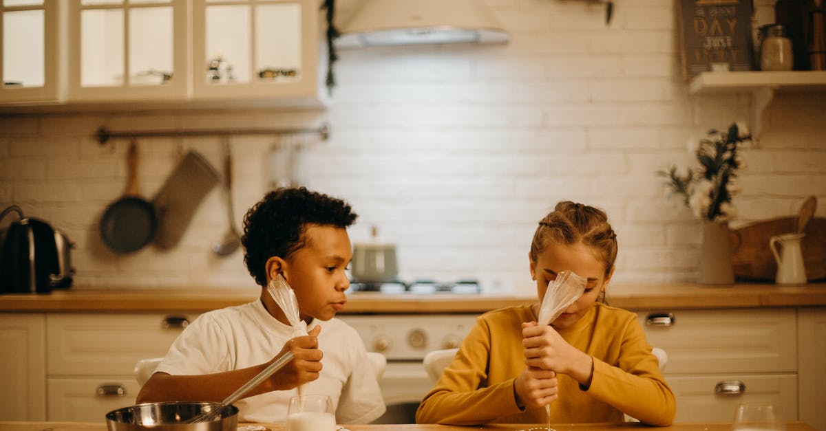 How do I practice piping icing without wasting icing and money? - Two Kids Putting Cream on Pastry