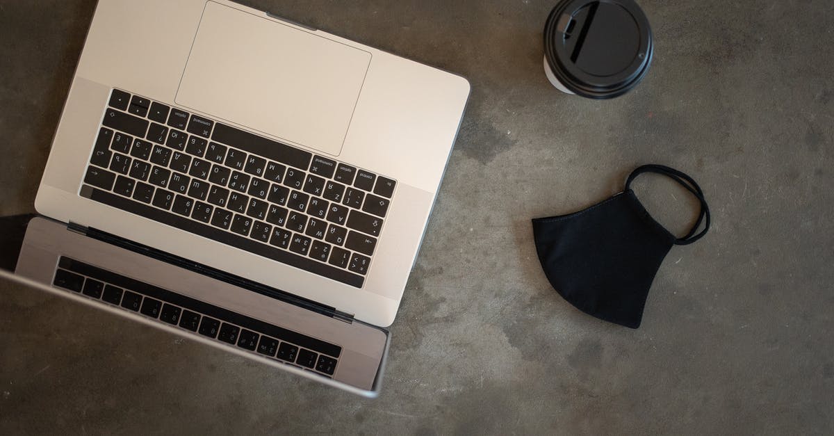 How do I prevent opened canned tuna from going stale? - Laptop near face mask on table