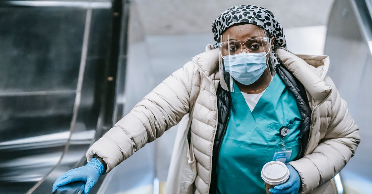 How do I prevent opened canned tuna from going stale? - Calm black nurse riding escalator in metro