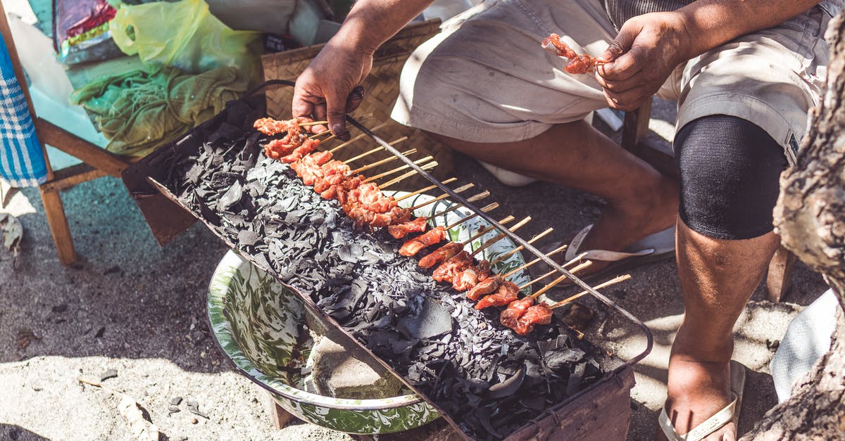 How do I prevent salmon sticking to the BBQ grill? - Person Cooking Street Food