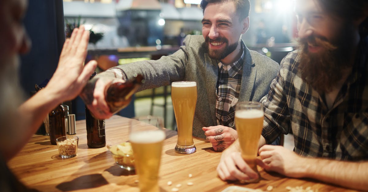 How do I quickly get okra to stop being goopy? - Men Smiling at a Bar