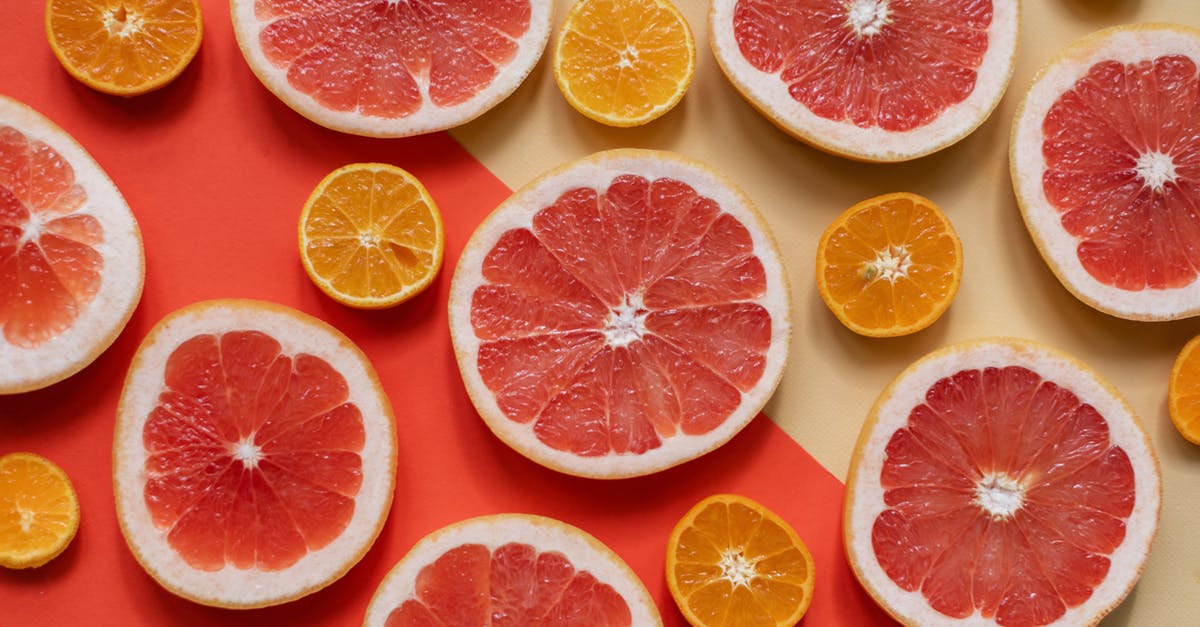 How do I ripen unripe oranges and grapefruits? - Sliced Citrus Fruits on Orange and Yellow Surface